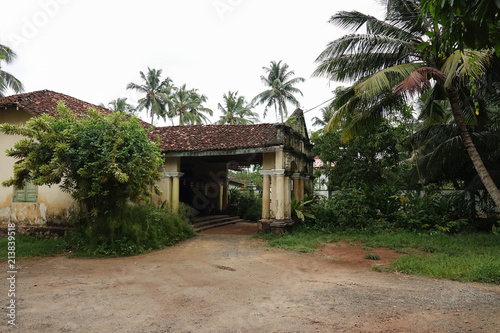 Aluthgama, Sri Lanka - May 04, 2018: Exterior view of the old house with columns of 1898 year of construction in Sri Lanka