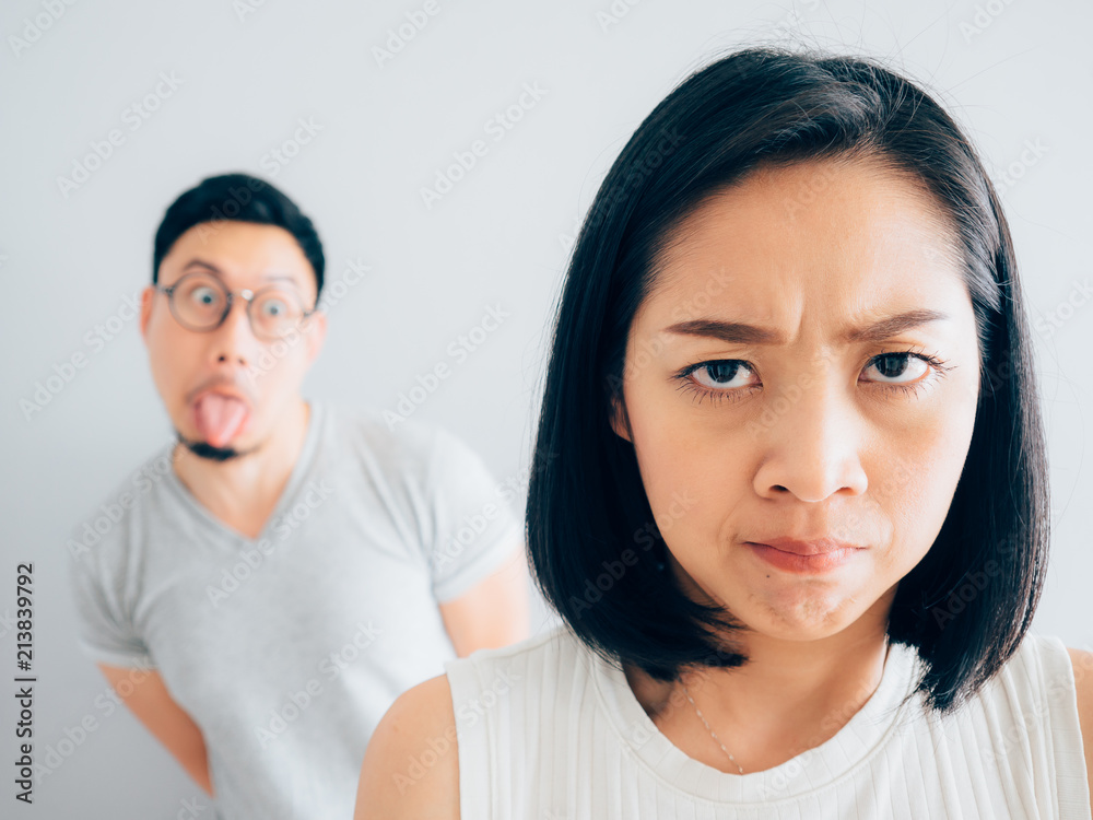 Annoyed wife and funny tricky husband. Annoyed wife and funny tricky husband.