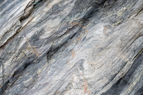 Gray surface of marble stone with striped streaks.