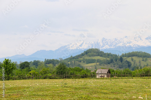 Old wooden barn in the village in Caucasus mountains