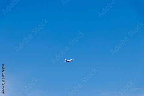 passenger airliner takes off to the blue sky background