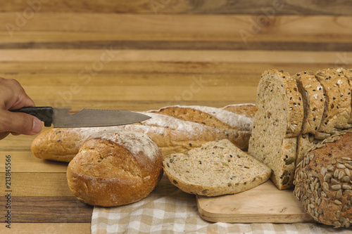 Whole grain bread on wooden background, healthy for dieting or breakfast