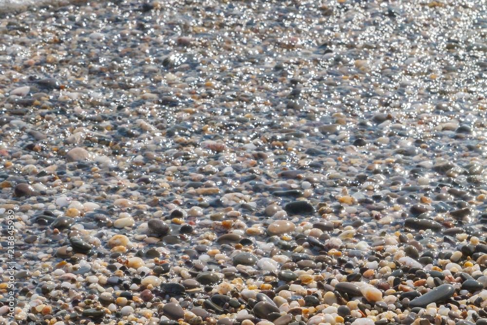 Sea stones on the seashore in the summer Sea stones on the seashore in the summer