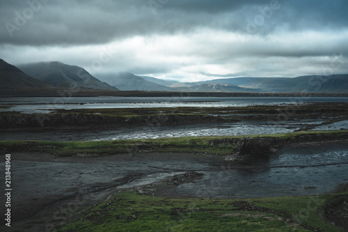 Light breaking through the sky on mountainous region in Iceland