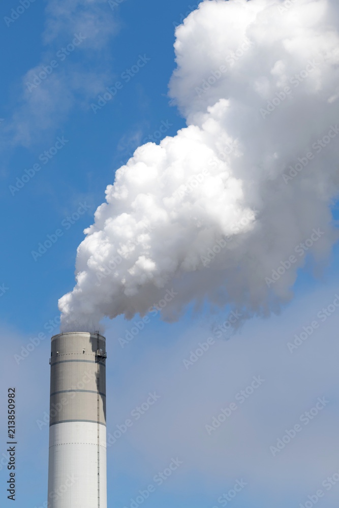 smoking chimney of a coal-fired power plant smoking chimney of a coal-fired power plant