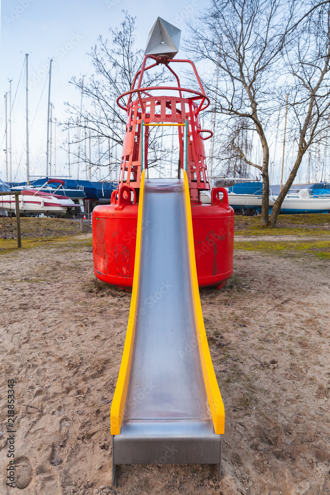 Slide made of old used navigation buoy Slide made of old used navigation buoy