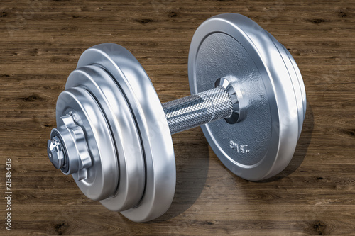 Dumbbell on the wooden background, 3D rendering