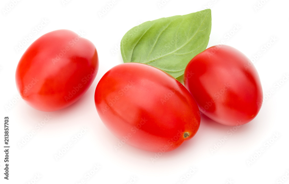 fresh plum tomato with basil leaf isolated on white background fresh plum tomato with basil leaf isolated on white background