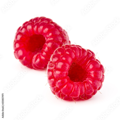 two ripe raspberries isolated on white background close up
