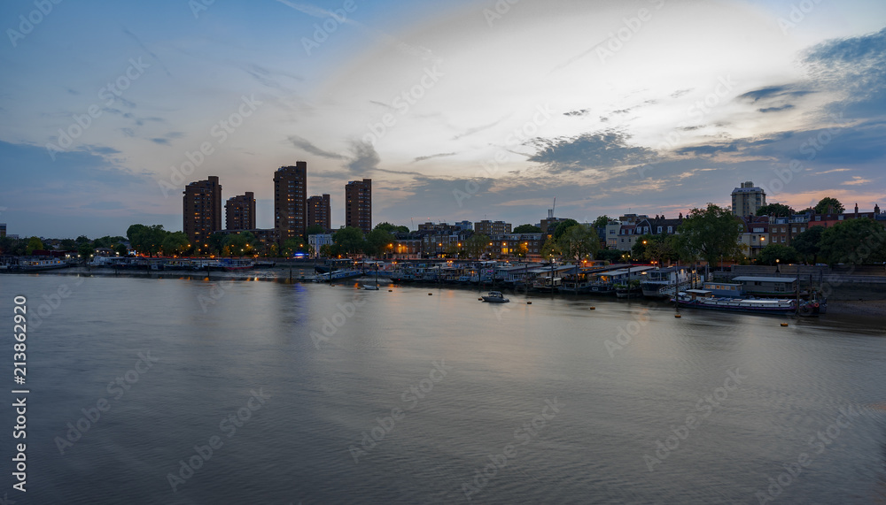 River Thames skyline at dusk looking towards Chelsea in London