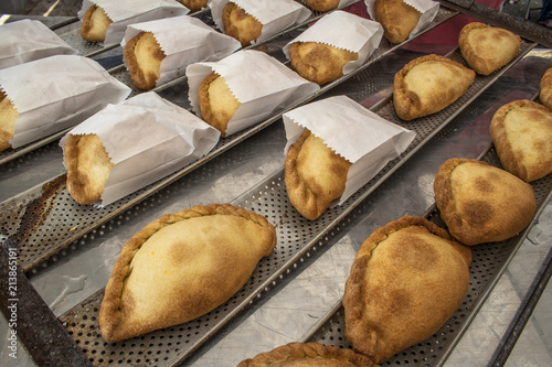 Bolivian Saltenas, traditional bolivian meat and potatoe baked food in market