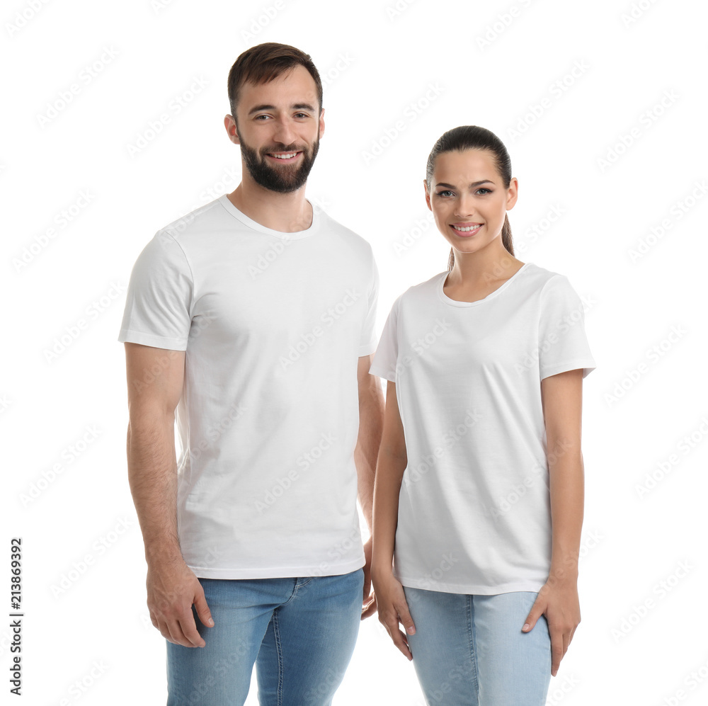 Fototapeta premium Young couple in t-shirts on white background. Mockup for design