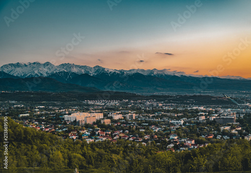 Sunset over the city of Almaty and a view of the Kok Tobe TV Tower