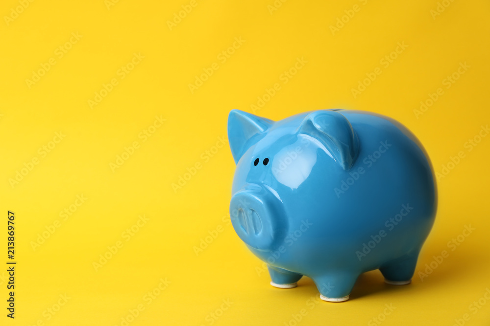 Blue piggy bank on color background. Money saving Blue piggy bank on color background. Money saving