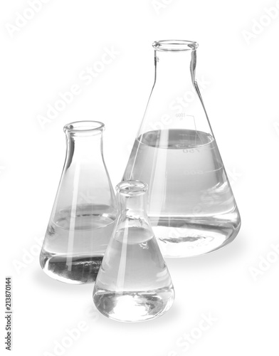 Flasks with liquid on white background. Laboratory analysis equipment