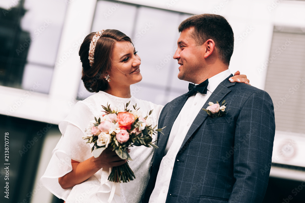 Newlyweds on a walk.Happy moments.Wedding photo shoot near the plane. Bride and groom, couple in love during a wedding photo session Newlyweds on a walk.Happy moments.Wedding photo shoot near the plane. Bride and groom, couple in love during a wedding photo session