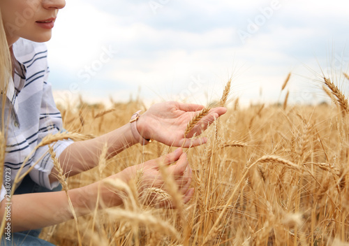 Young agronomist in grain field. Cereal farming