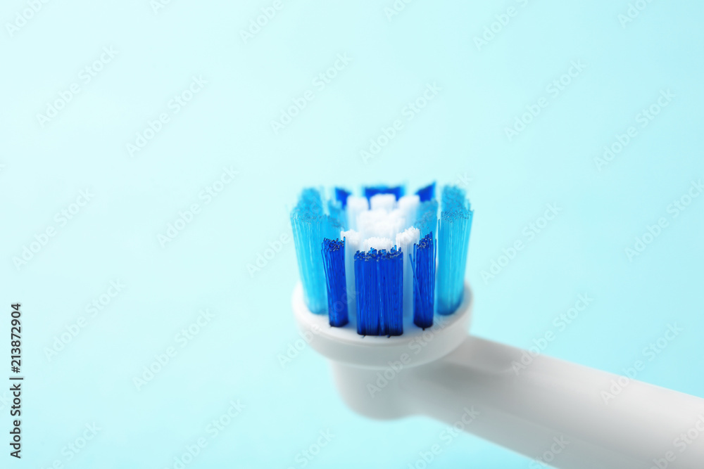 Electric toothbrush on color background, close up. Dental care