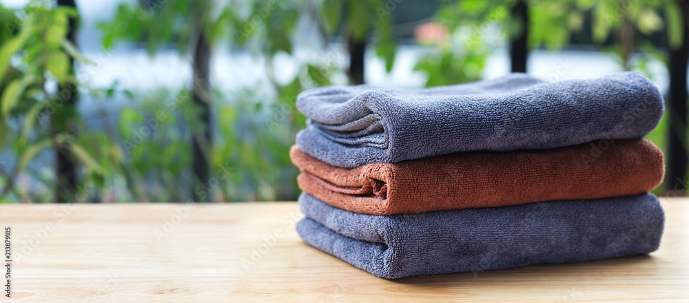 Stack of microfiber cloth on table with copy space. Stack of microfiber cloth on table with copy space.