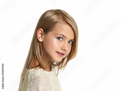 Portrait of the beautiful child on a white background