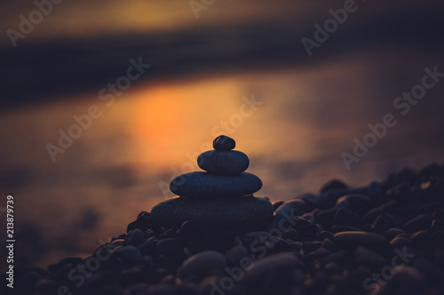 stack of zen stones on pebble beach