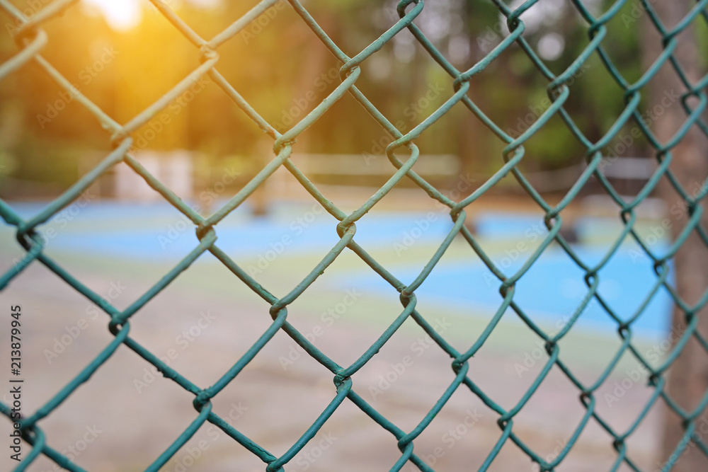 Steel wire mesh fence with sunlight. Steel wire mesh fence with sunlight.