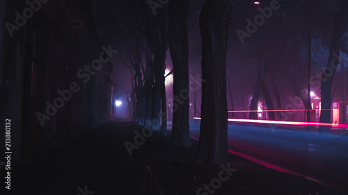 neon rainy fogy moody empty street long exposure