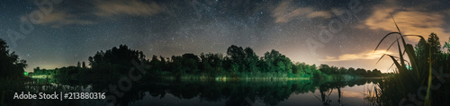 beautiful panoramic view on a sky at the night in a forest and river