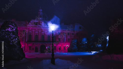 neon building snowy night moody