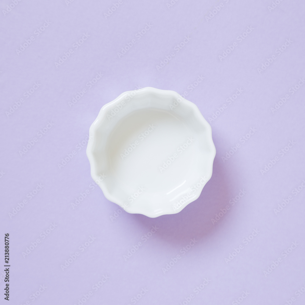 White dish isolated on purple background White dish isolated on purple background