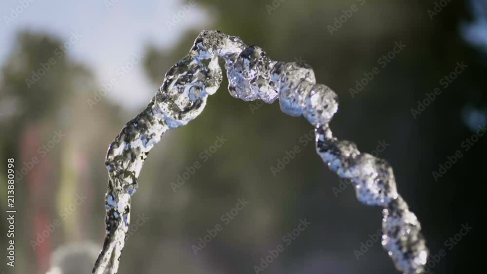 Close-up shot of water drops of fountain in the summer park. Slow motion. HD Close-up shot of water drops of fountain in the summer park. Slow motion. HD