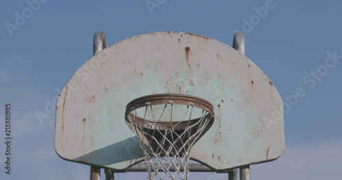 Rusty Basketball Hoop In Empty Playground