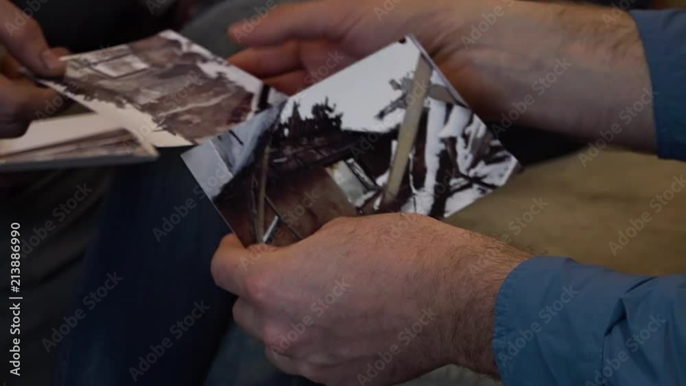 A shot of a man looking to photos of the crisis in Ukraine. A shot of a man looking to photos of the crisis in Ukraine.