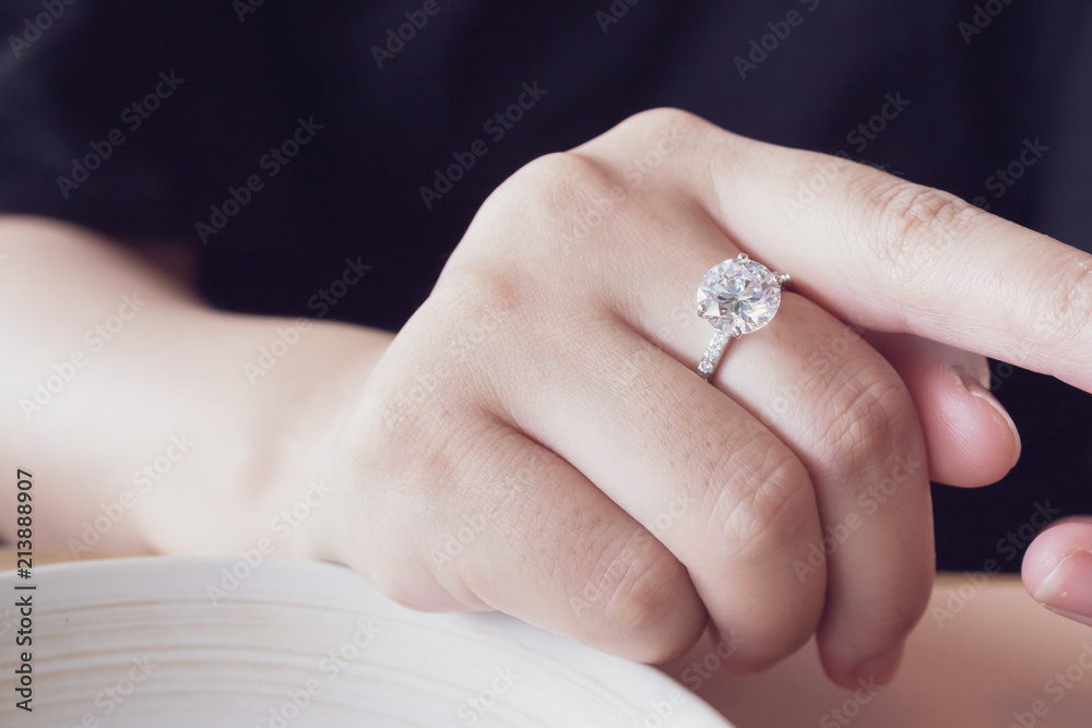 engagement diamond ring on woman finger closeup engagement diamond ring on woman finger closeup