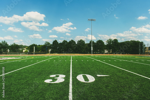 30 Yard Line on American Football Field and blue sky photo