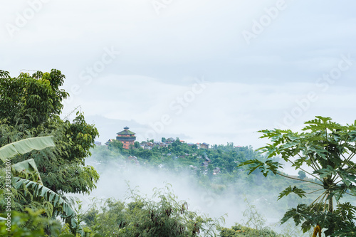 Nuwakot ancient castle tower appears in the morning haze from a hilltop near Nuwakot village, Nepal. photo
