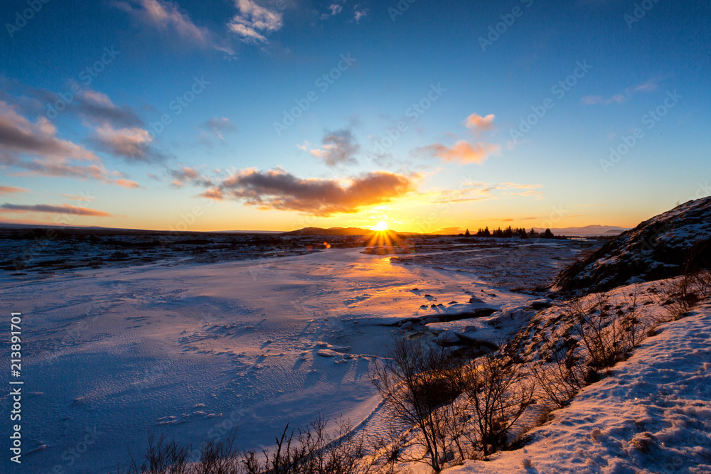 Fototapeta premium Sunset on icelandeic tundra with snow and ice