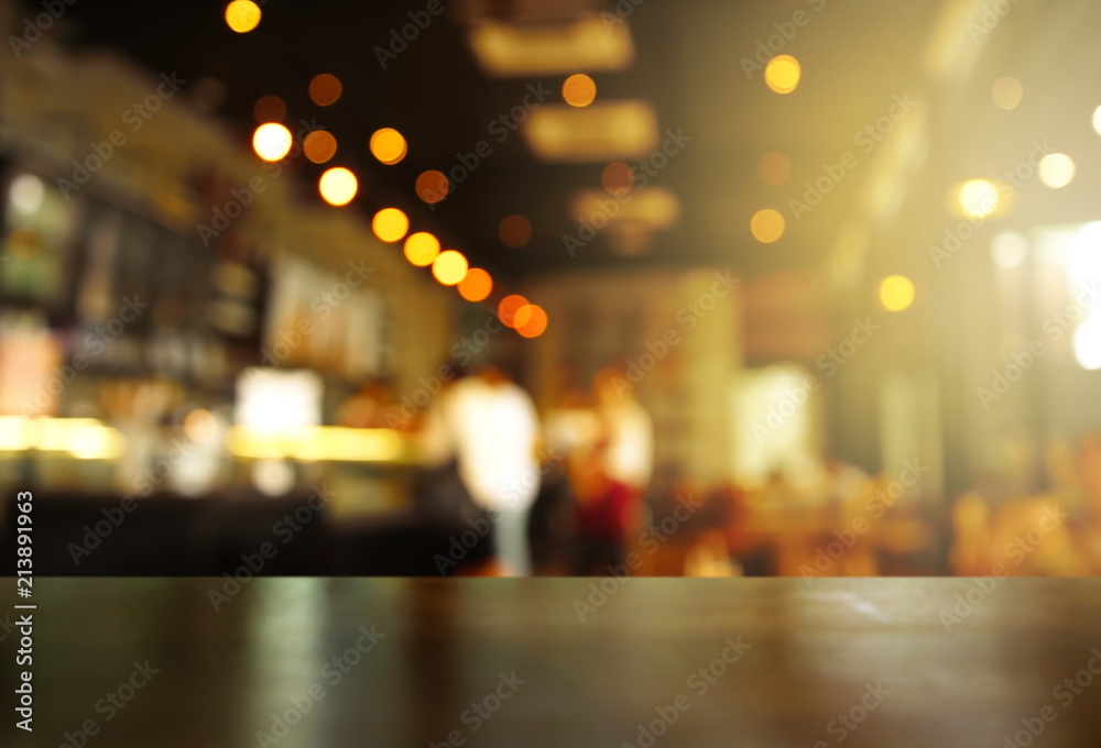 top of wood table with light of blur pub or bar in the dark night background - obrazy, fototapety, plakaty 