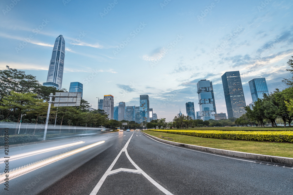 urban city road with motion bus at twilight, china.