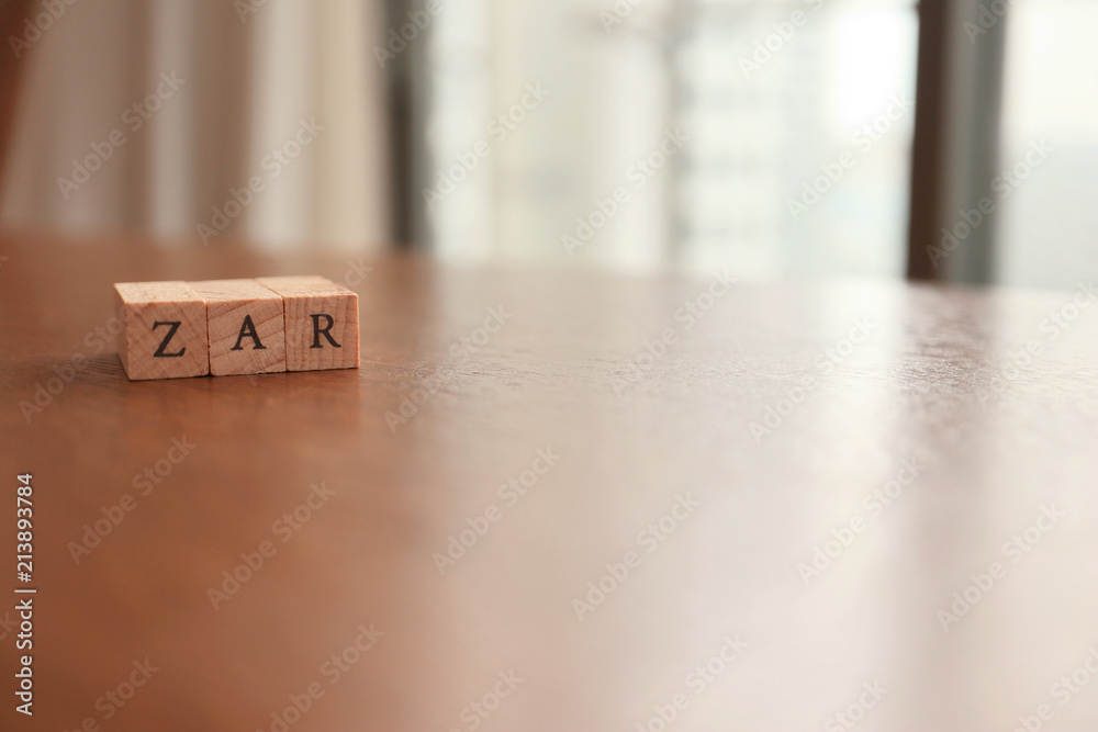 ZAR (South African Rand) Text Block on Wooden Table ZAR (South African Rand) Text Block on Wooden Table