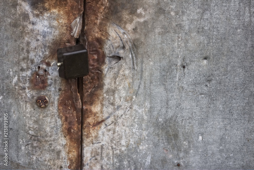 Photo of rust locked metal doors and keylock
