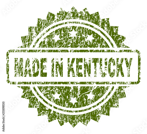 MADE IN KENTUCKY stamp seal watermark with rubber print style. Green vector rubber print of MADE IN KENTUCKY title with unclean texture.