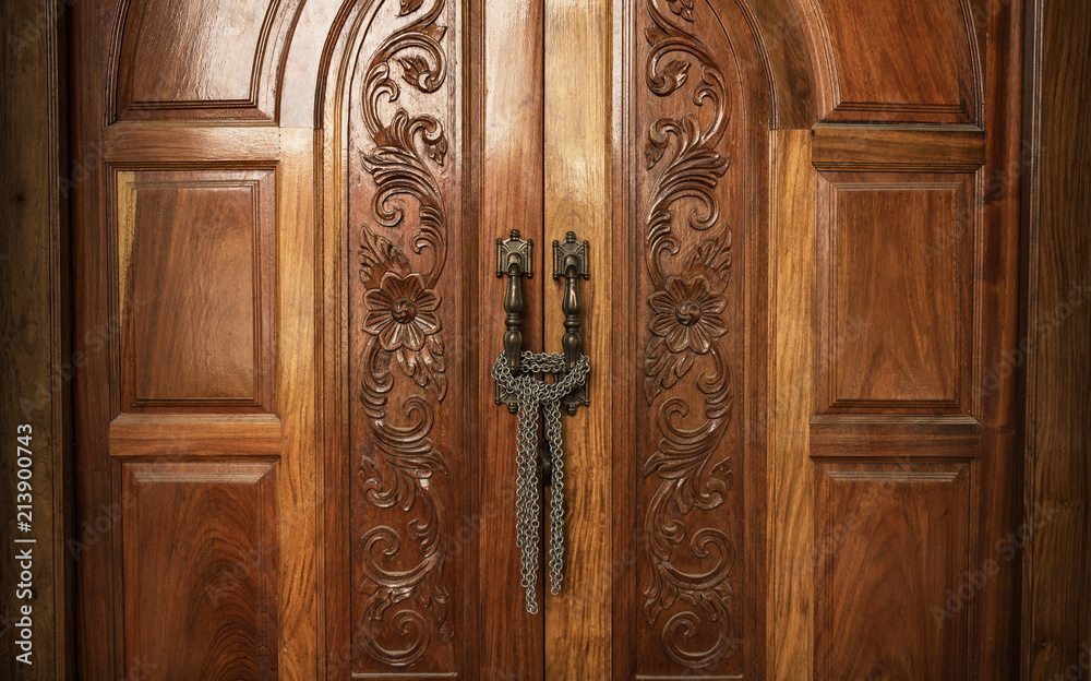Fototapeta premium Wooden door with lock chain