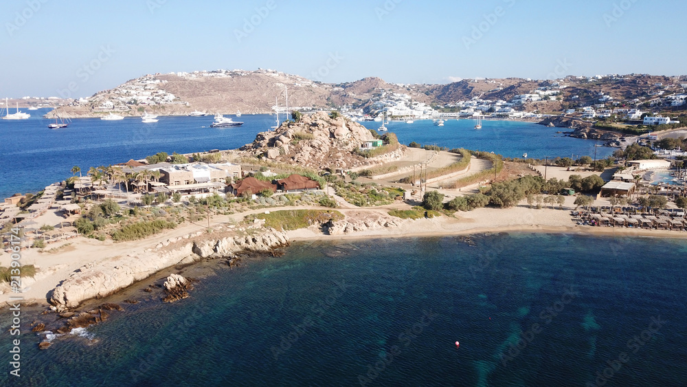 Aerial drone bird's eye view from famous beach of Paraga featuring famous night club of Skorpios and Santanna with largest pool in Europe, Mykonos island, Cyclades, Greece