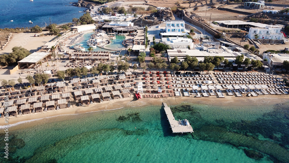 Aerial drone bird's eye view from famous beach of Paraga with emerald waters, Mykonos island, Cyclades, Greece
