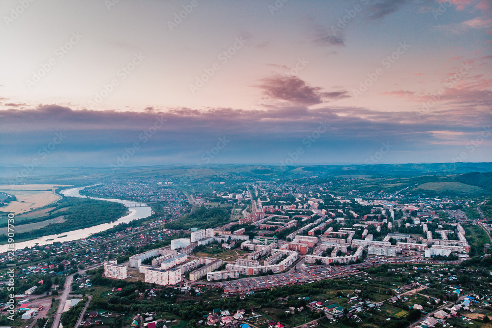 Osinniki, RUSSIA - July 17, 2018: Aerial photography of city in Kemerovo region, city near river