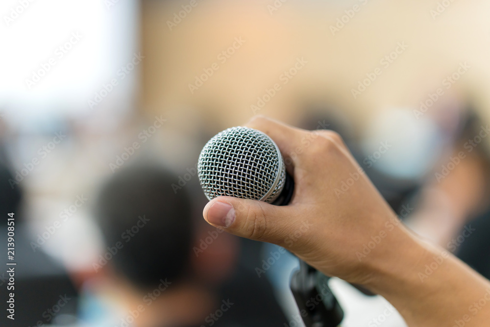 hand hold Microphone in meeting room for a conference hand hold Microphone in meeting room for a conference