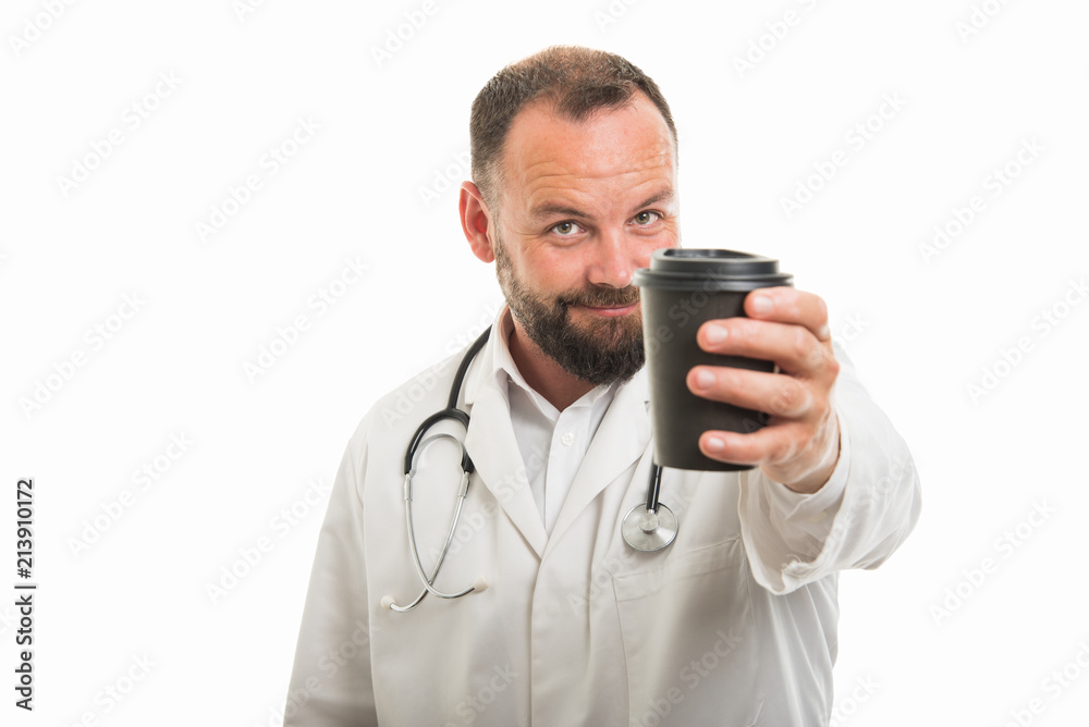 Portrait of male doctor handing to go coffee cup Portrait of male doctor handing to go coffee cup