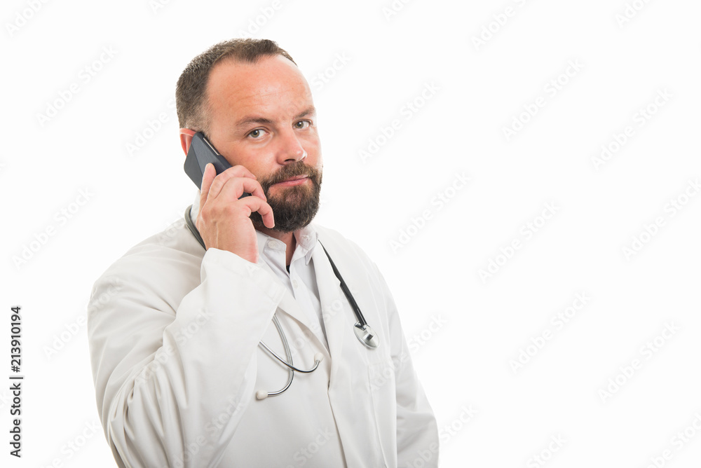 Portrait of male doctor talking on smartphone Portrait of male doctor talking on smartphone