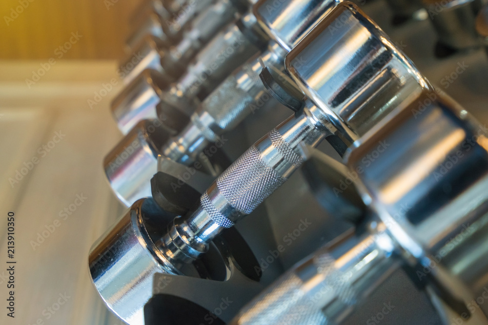 dumbbells in the gym at sports club for exercise and Bodybuilding dumbbells in the gym at sports club for exercise and Bodybuilding